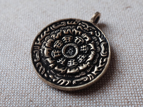 Tibetan OM calendar pendant