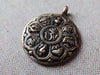 Tibetan OM calendar pendant