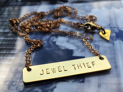 Raw brass "JEWEL THIEF" necklace